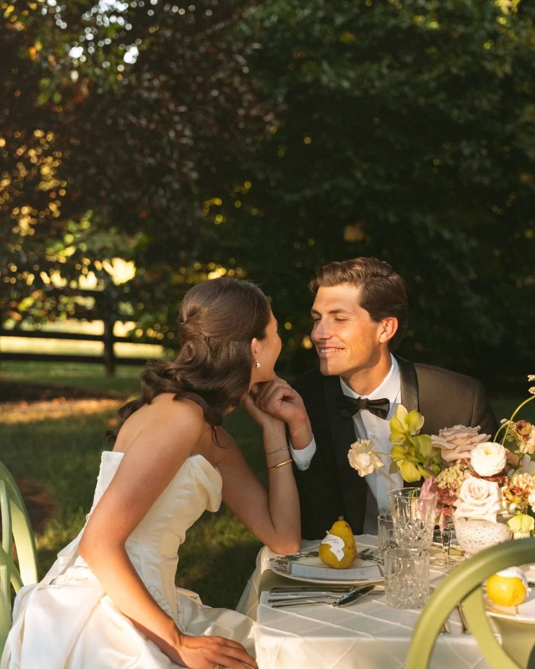 Bride and groom sharing a moment at an outdoor reception